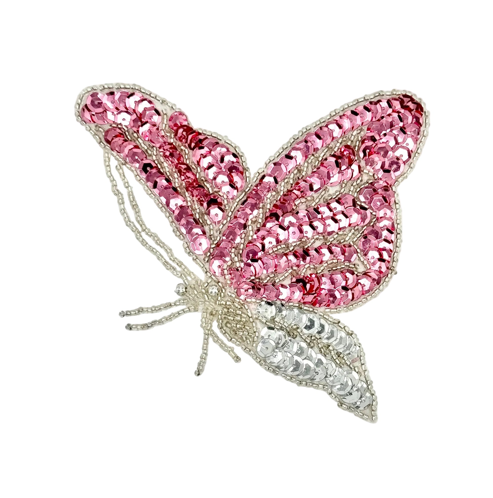 Pink butterfly-shaped patch with sequin and bead details on a white background