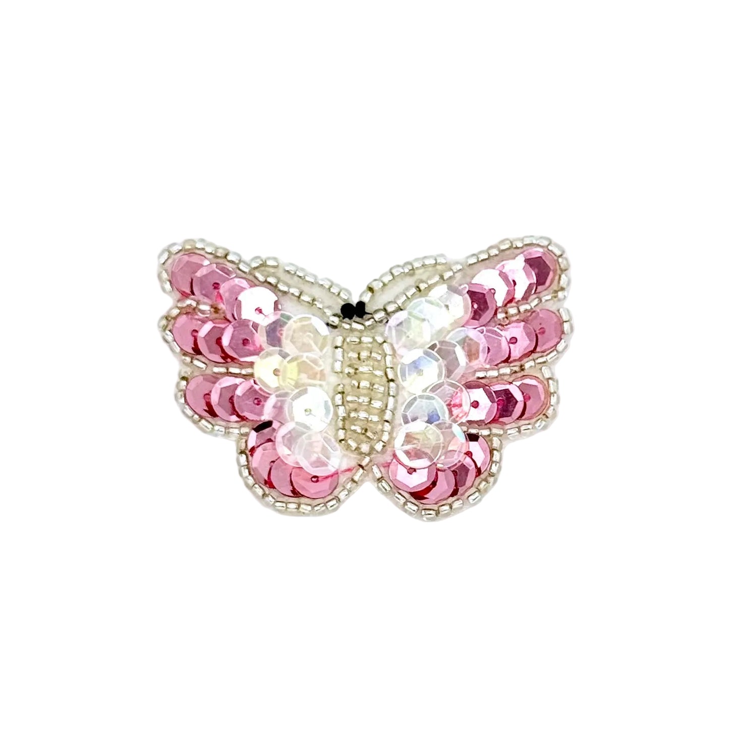 Butterfly-shaped decorative item with pink and white sequins on a white background