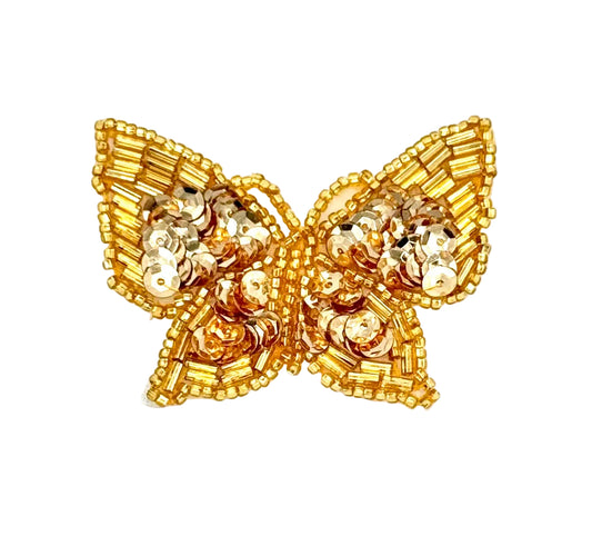 Gold butterfly-shaped patch on a white background