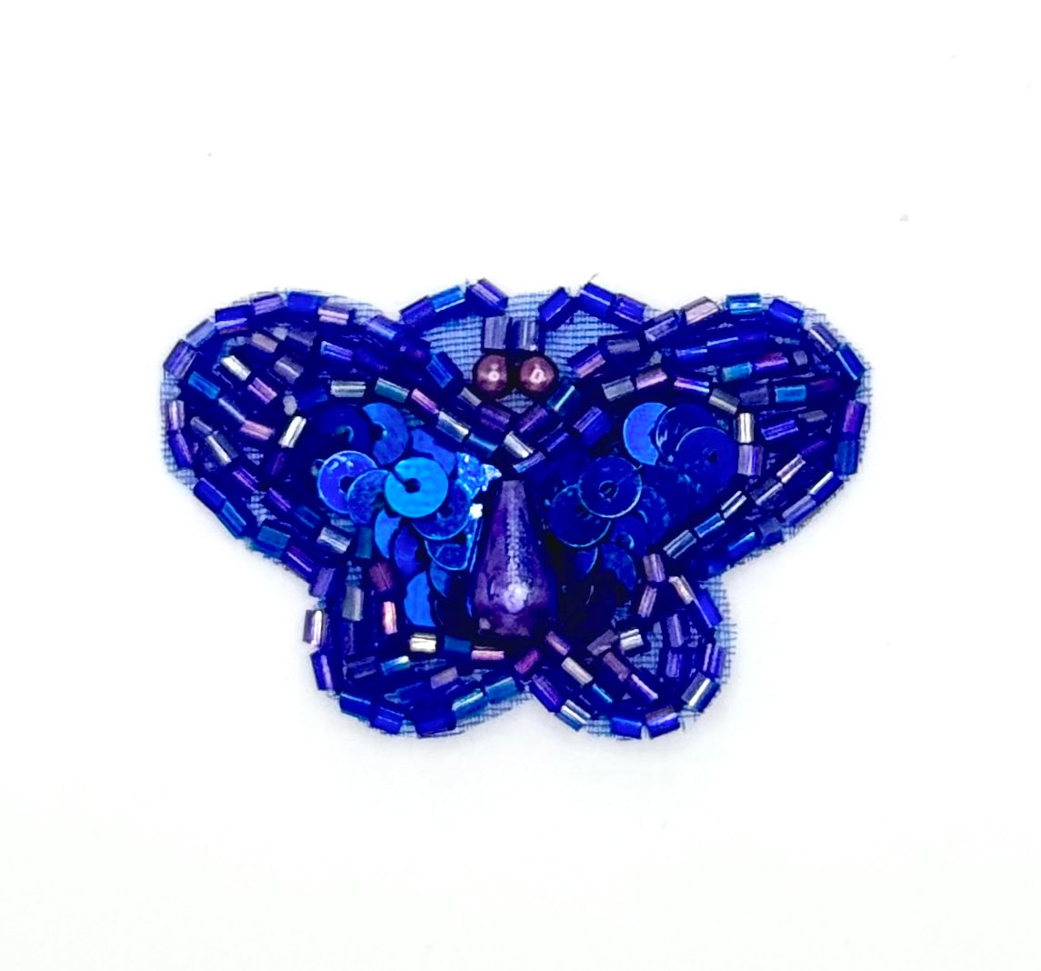 Blue beaded butterfly on a white background