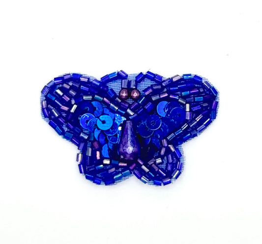 Blue beaded butterfly on a white background