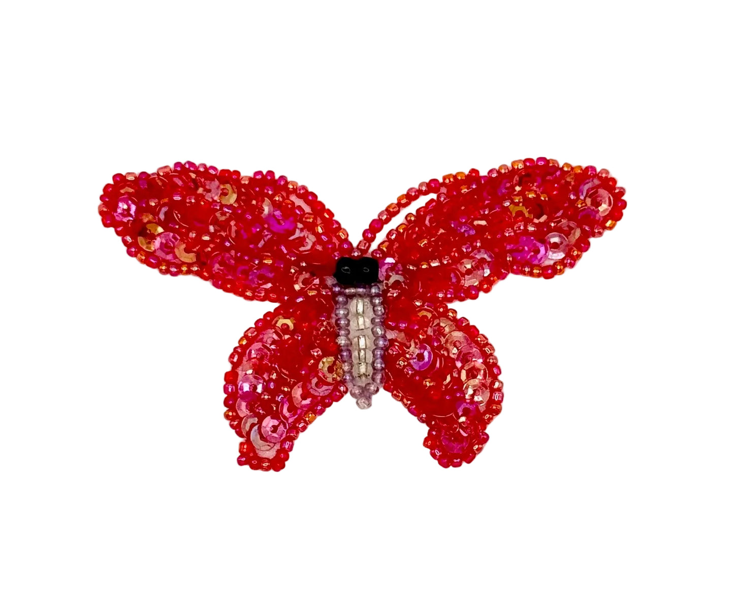 Red butterfly-shaped decorative item with beads on a white background