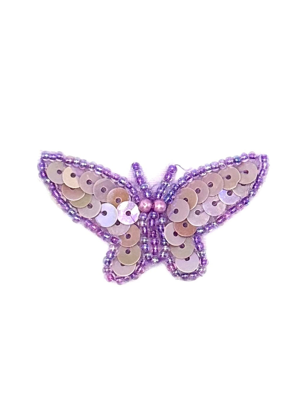 Butterfly-shaped patch with sequins on a white background