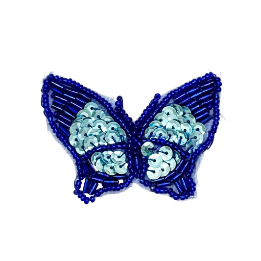 Butterfly-shaped patch with blue beading and light blue sequins on a white background