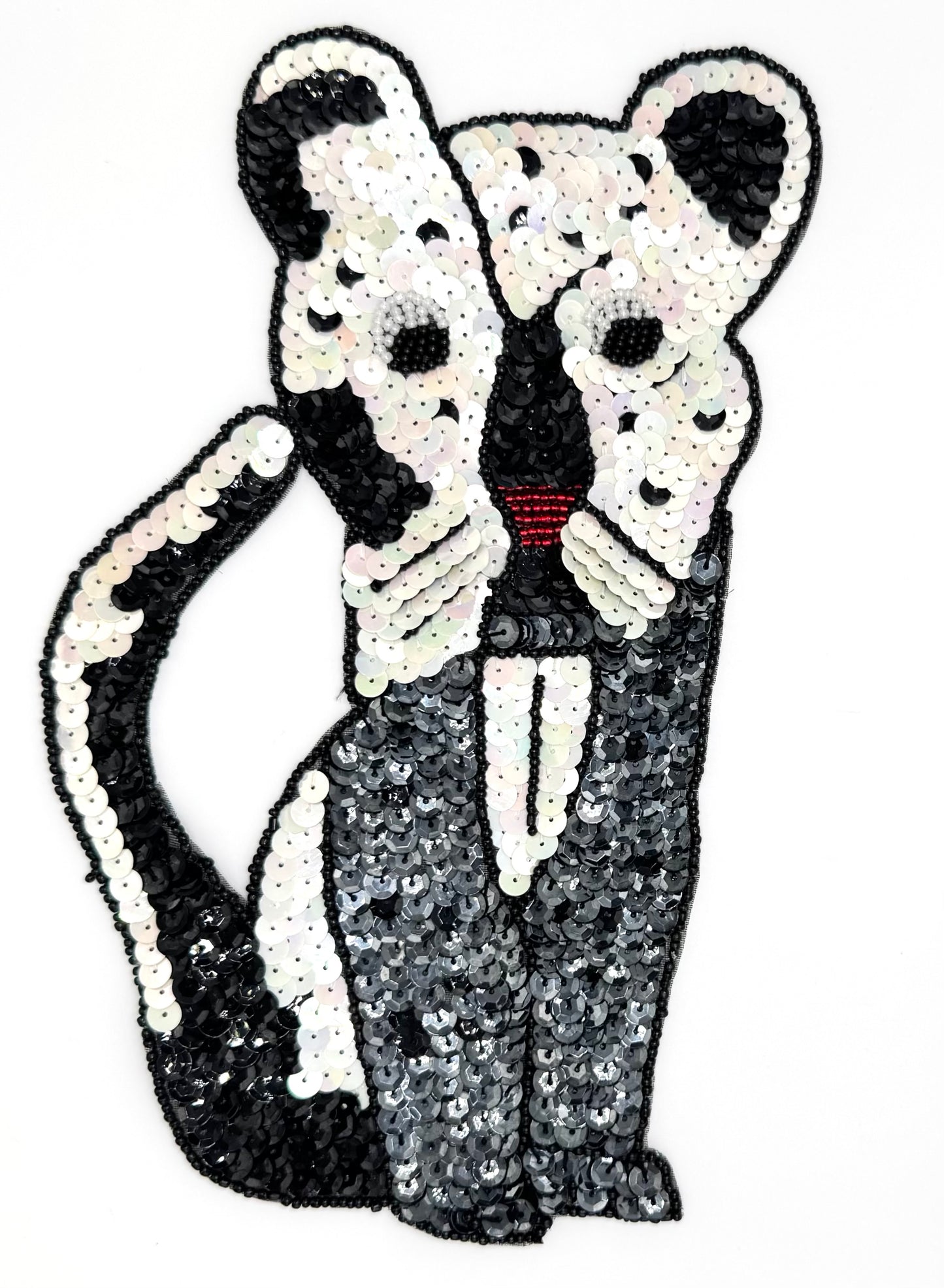 Sequin and bead cat on a white background