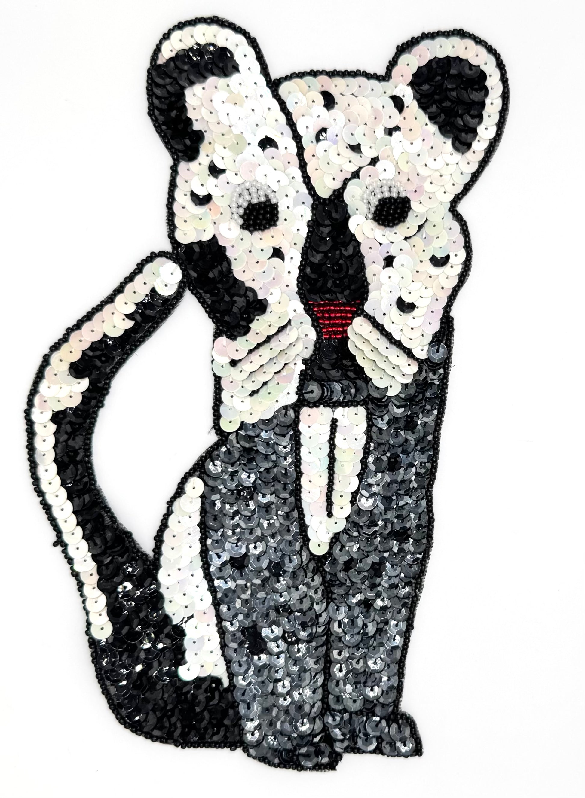 Sequin and bead cat on a white background