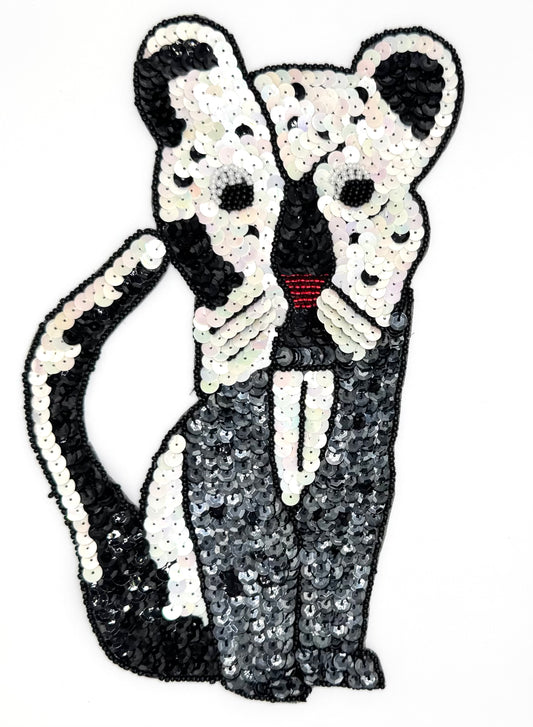 Sequin and bead cat on a white background