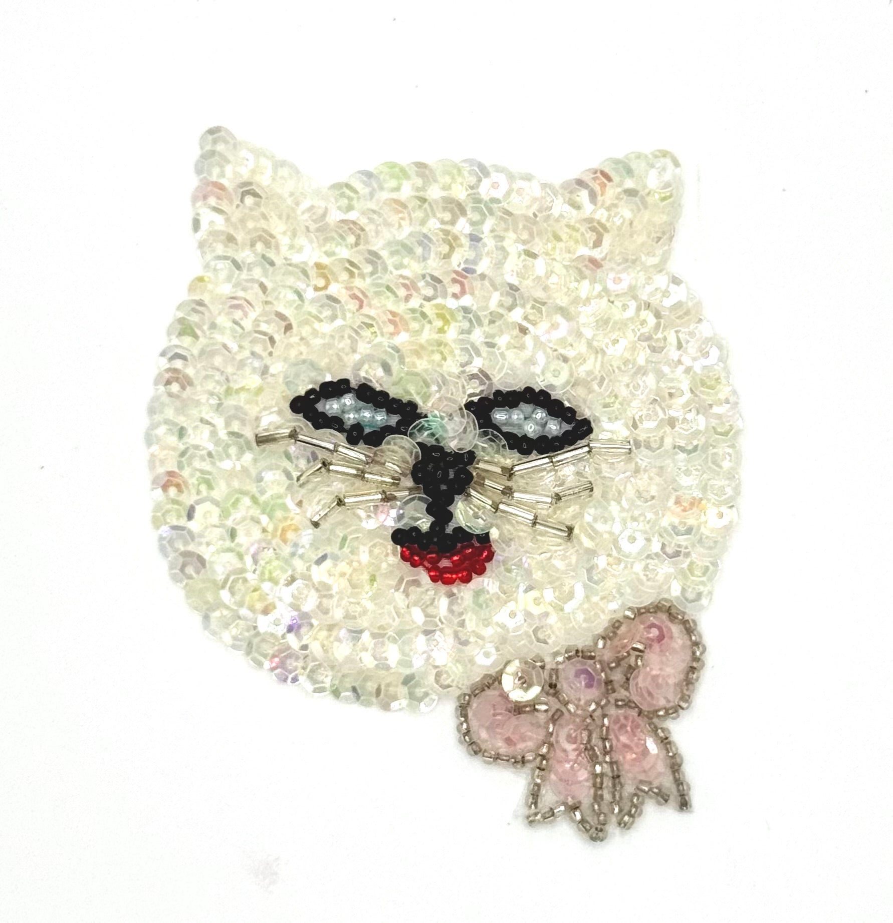 Sequin cat face with beads on a white background