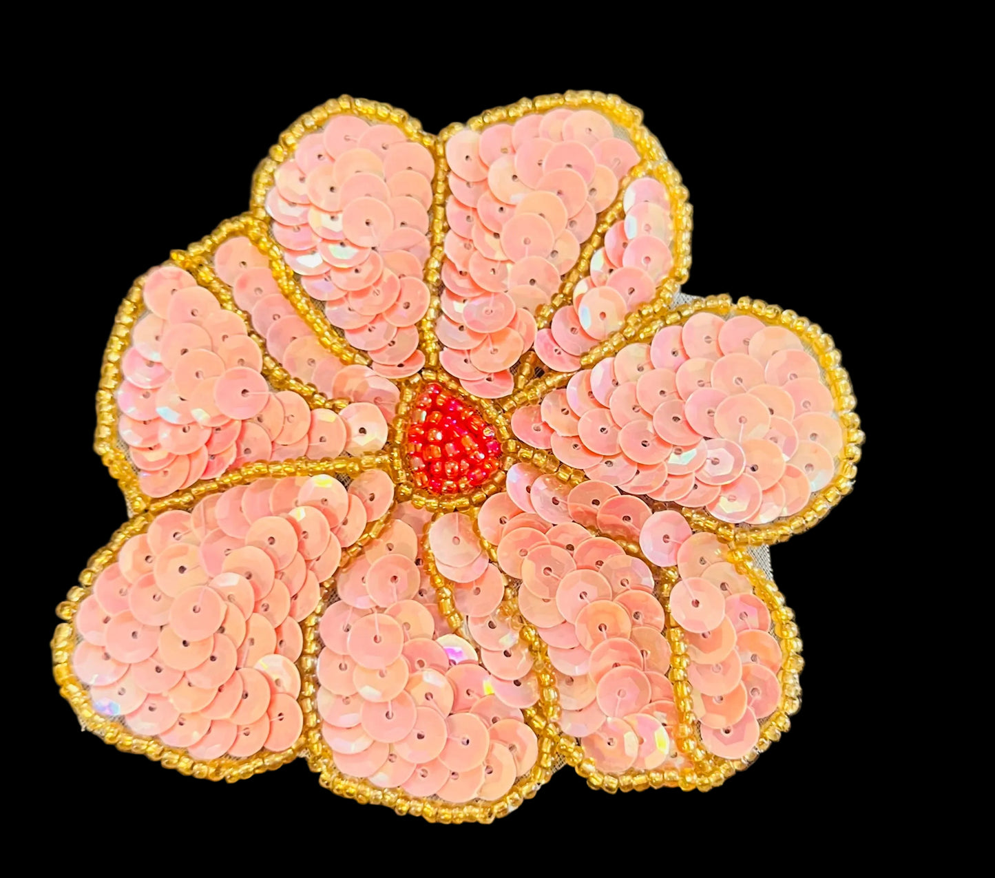 Flor con lentejuelas y cuentas rosas