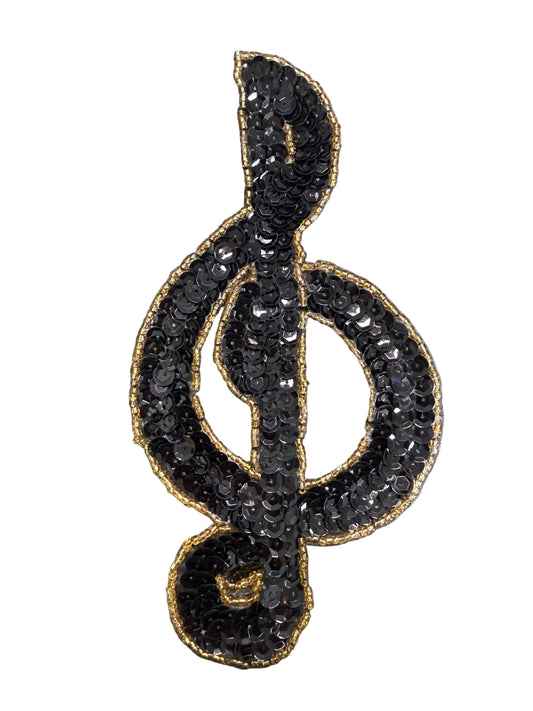 Clave de Sol con Lentejuelas Negras y Ribete de Cuentas Doradas 17.78 cm x 8.89 cm