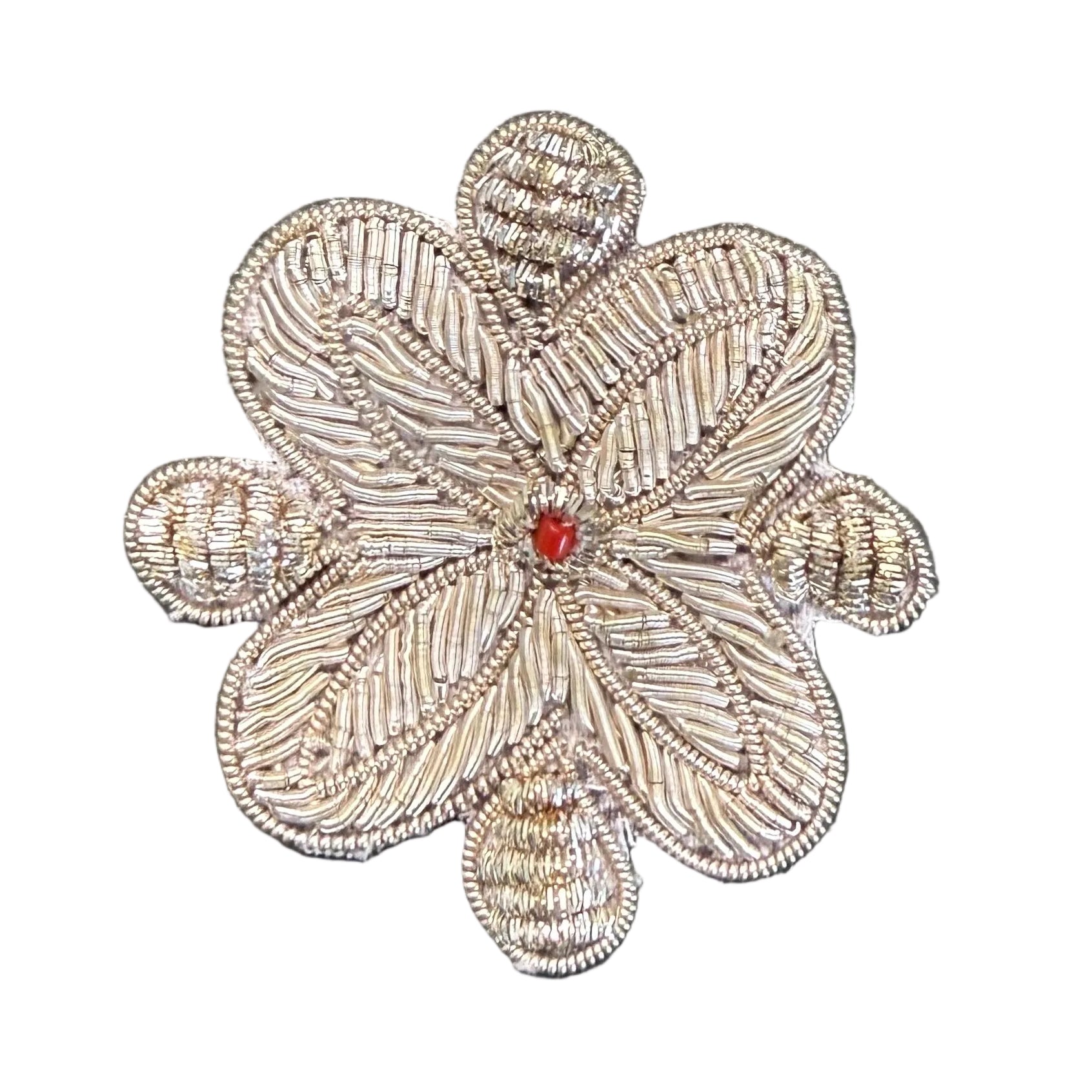 Silver bullion flower appliqué with dense bugle bead fill, cord outline, coiled petal tips, and red jewel center
