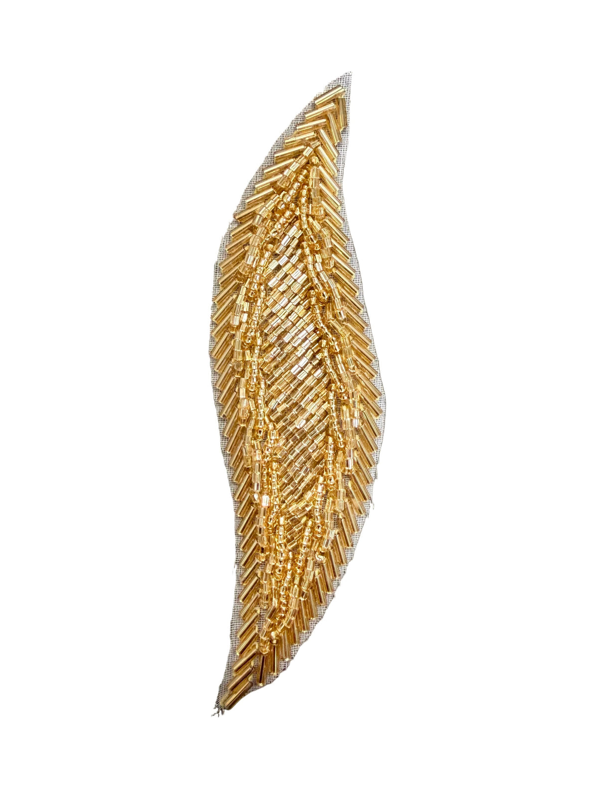 A single decorative patch shaped like a stylized leaf or feather, covered in gold-toned  beads. 