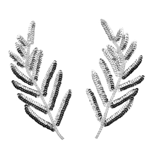 Pair of leaf-shaped silver sequin patches on a white background
