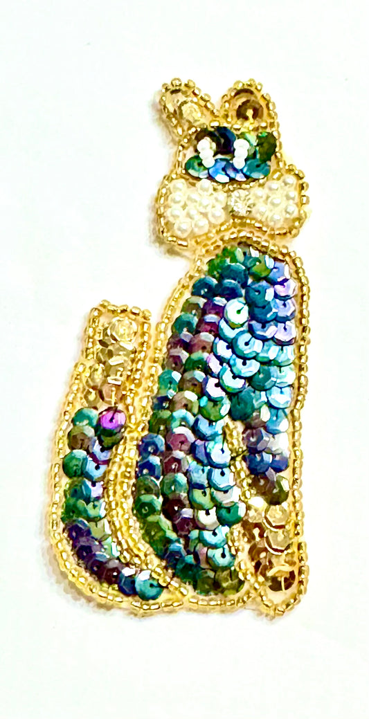 Cat with Moonlight and Gold Sequins, Gold Beads, a Pearl Bow with a Rhinestone and Eyes with Iridescent Beads 3.5" x 2"