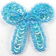 Load image into Gallery viewer, Bow with Lite Turquoise Sequins and Beads 1.25&quot; x 2&quot;