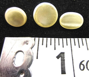Buttons Three Sizes Creamy Pearl 1/4" A whole Bag weighing 4.4 ounces.